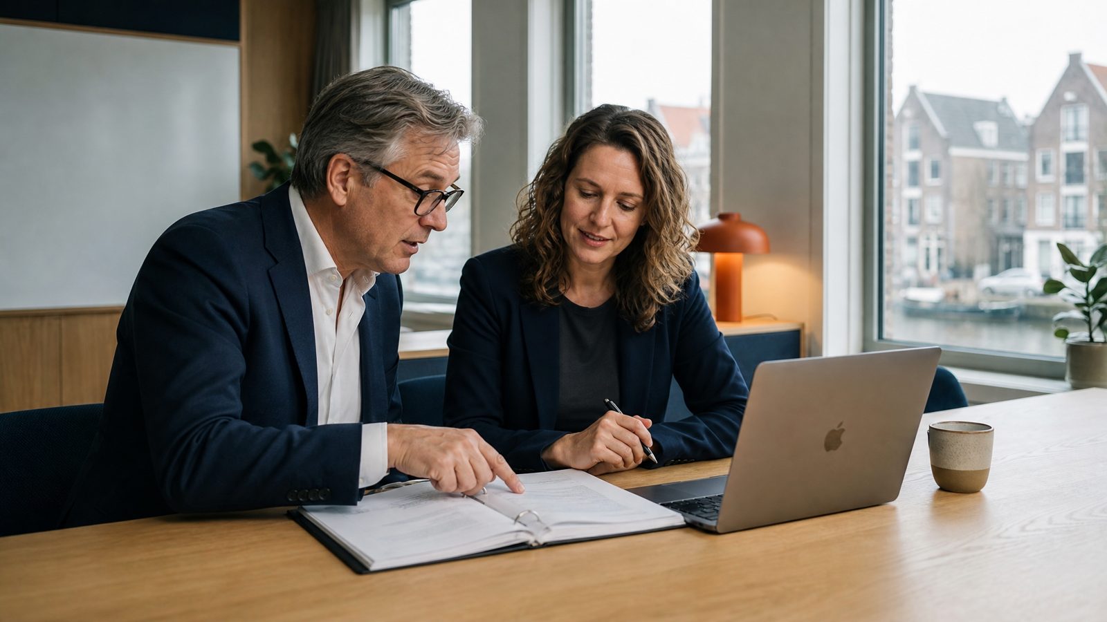 Interim HR professional reviewing policy documents with a senior HRhelp consultant